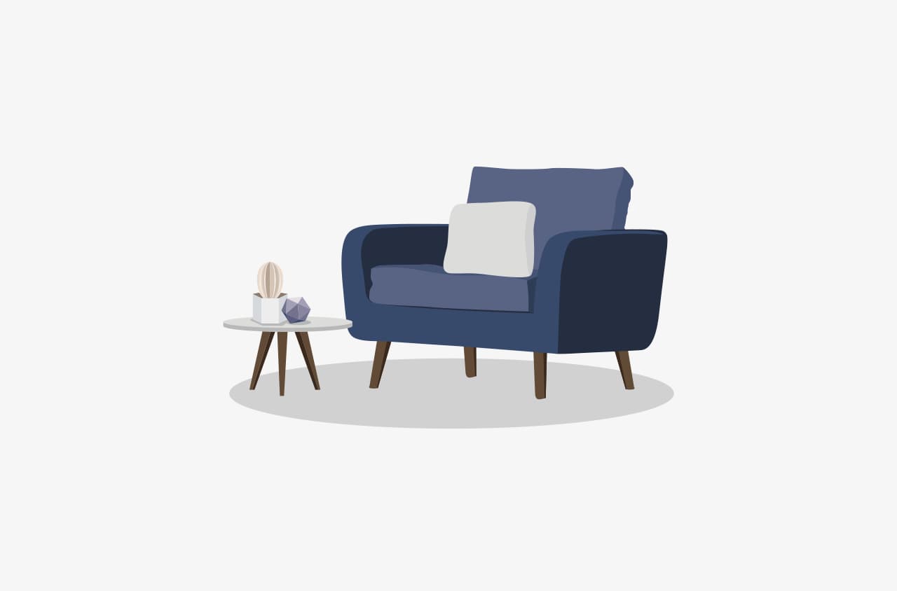 Dark blue armchair with cushion and side table.